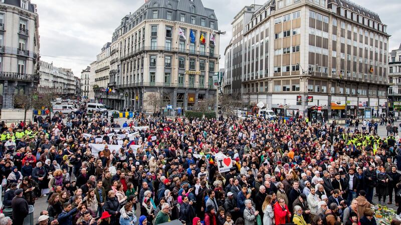 People gather in front of Brussels Stock Exchange to commemorate the victims of last year’s terrorist attacks in the city. Photograph: Stephanie LeCocq/EPA