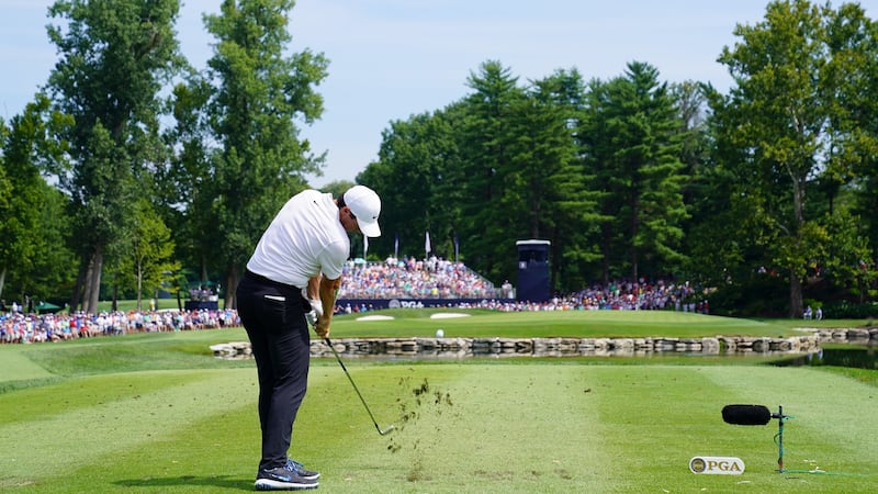 Rory McIlroy hits his tee shot on the eighth. Photo: Stuart Franklin/Getty Images