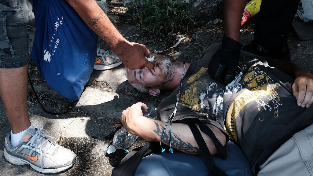 A man administers Adapt Pharma’s Narcan as they try to revive a man who overdosed on heroin in Philadelphia. The man later came to and was taken to the hospital. Photograph: Spencer Platt/Getty Images