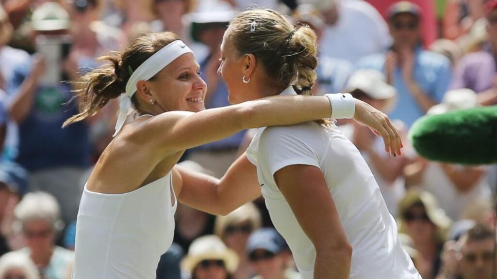 Petra Kvitova of the Czech Republic (right) hugs compatriot Lucie Safarova whom she defeated in their semi final match at Wimbledon. Photograph: Tatyana Zenkovich