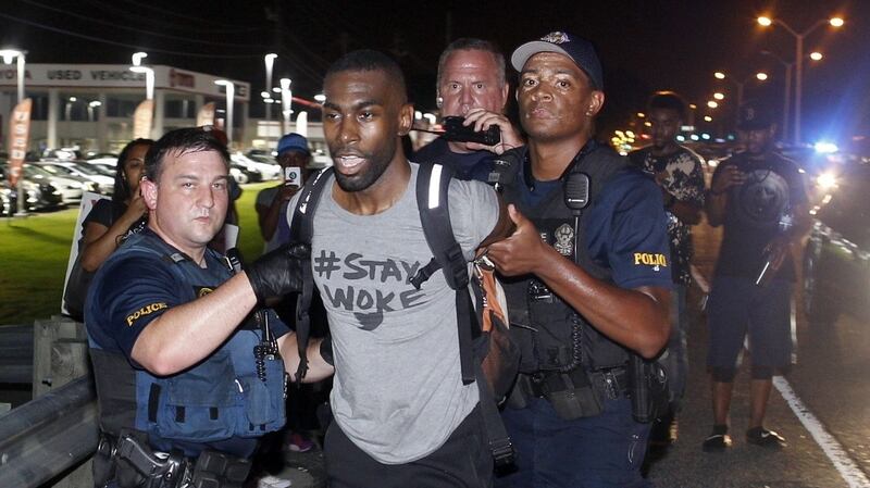 Police arrest activist DeRay McKesson during a protest along Airline Highway, a major road that passes in front of the Baton Rouge police department headquarters on Saturday in Baton Rouge, Louisiana. Photograph: AP