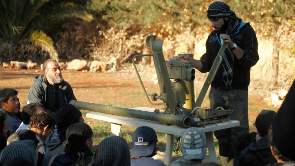 A Free Syrian Army trainer addresses fighters as he conducts a demonstration on how to use anti-tank and anti-aircraft weapons at a training camp in the northern countryside of Aleppo, Syria, yesterday. Photograph: Ammar Abdullah/Reuters