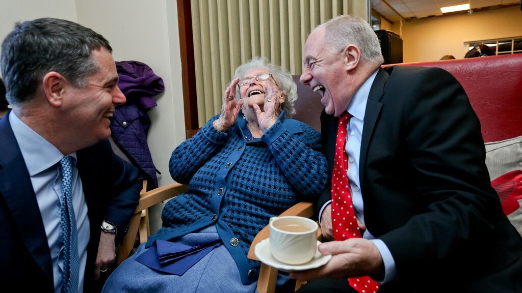 Michael Ring and Paschal Donohoe with 100-year-old Bridget Byrne at the announcement of increased funds for the regeneration of Dublin’s north inner city, at Lourdes Day Care Centre. Photograph: Maxwell’s