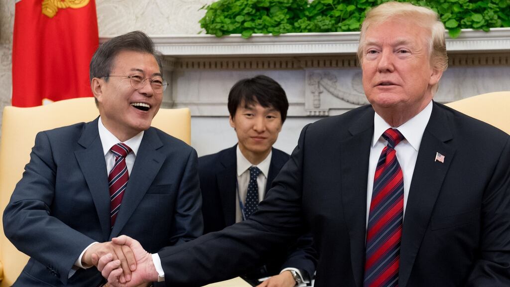 US president Donald Trump and South Korean president Moon Jae-in shake hands during a meeting in the Oval Office of the White House on Tuesday. Photograph: Saul Loeb/AFP/Getty Images