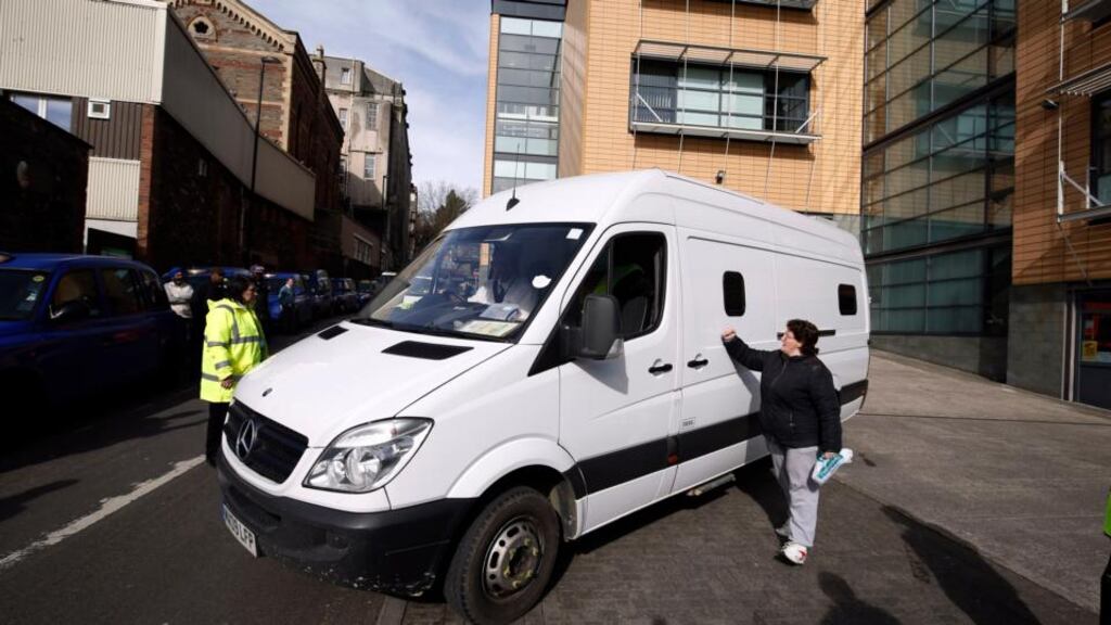 Belinda Robinson, 45, from Bristol bangs her fist onto a prison van as it leaves the Magistrates court in Bristol, where Nathan Matthews, 28, the stepbrother of 16-year-old Becky Watts has appeared charged with her murder. Photograph: Steve Parsons/PA Wire.