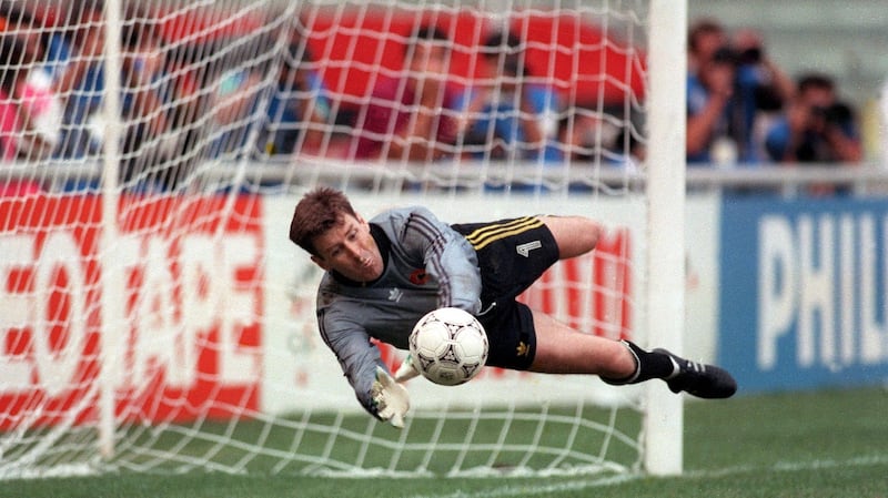 Republic of Ireland goalkeeper Packie Bonner saves a penalty during the shoot-out against Romania at the 1990 World Cup. Photograph: Billy Stickland/Inpho