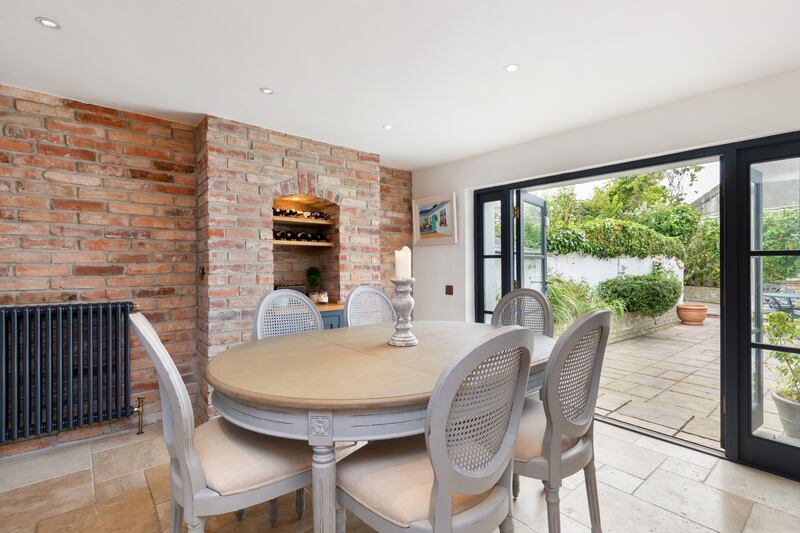 A fine kitchen and dining area lies to the rear and now opens through two large doors to the rear garden, allowing the two spaces to become one during good weather.