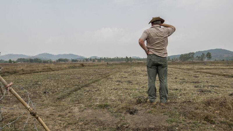 Mark Whiteside of the Mines Advisory Group (MAG) oversees the clearing of a rice field for a local farmer in Phonsavan, northeast Laos. Photograph: Brenda Fitzsimons