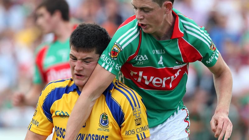Danny Qualter in action for the Roscommon minors aginst the late David Gavin of Mayo. Photograph: Inpho