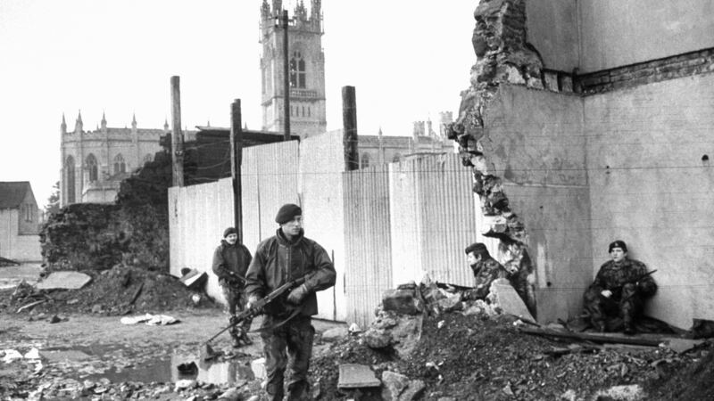 British soldiers patrol the bombed-out ruins of the Broadway Hotel in Newry, Northern Ireland in 1972. Photograph: Terence Spencer/The LIFE Picture Collection/Getty Images.