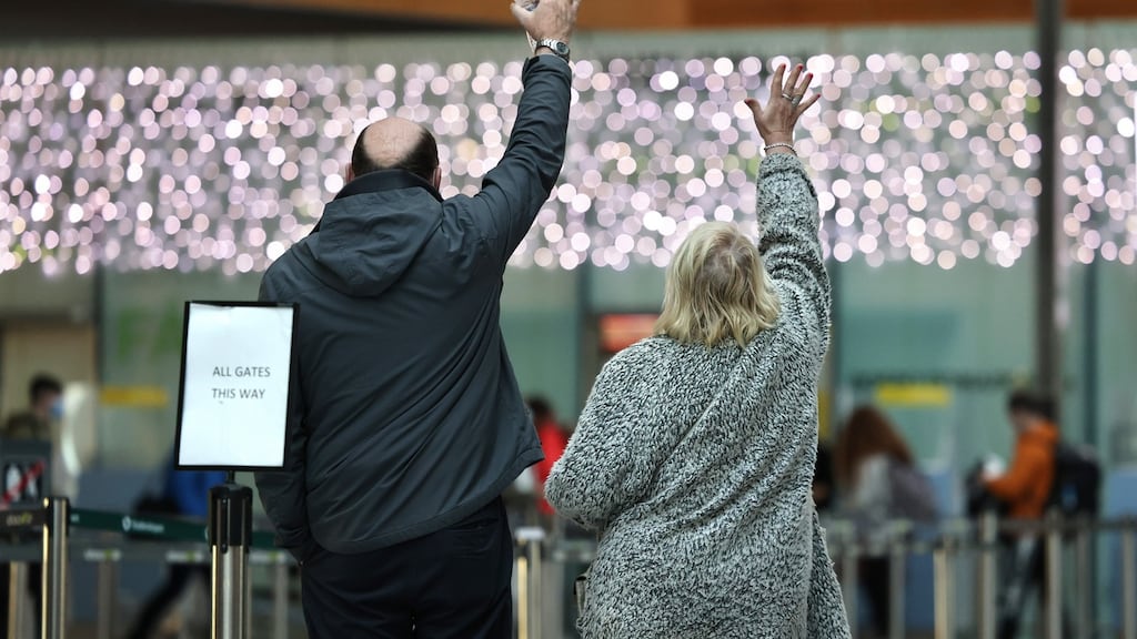 So long: Waving goodbye to family at Dublin Airport after Christmas. Photographs: Dara MacDónaill/The Irish Times