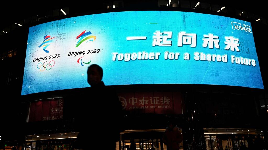 An outdoor screen shows the slogan for the Beijing 2022 Winter Olympics and Paralympic Games, which reads ‘Together for a Shared Future’, in Beijing, on Wednesday. Photograph: Jade Gao/AFP/Getty