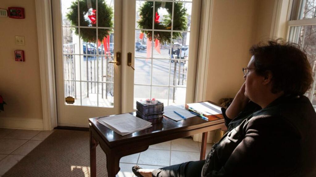 Anne Alzapiedi, of the Newtown Selectman’s office waits for journalists to pick up the 911 recordings in Danbury, Connecticut yesterday . Photograph: Michelle McLoughlin/Reuters