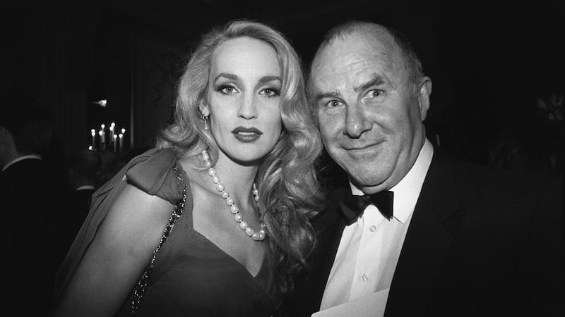 Clive James with model Jerry Hall at the Baftas in 1990. Photograph: PA