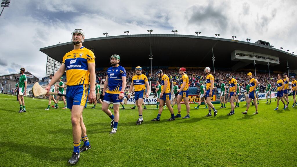 Clare’s Patrick O’Connor leads the team during the pre-match parade against Limerick in Thurles. Photograph: Cathal Noonan/Inpho