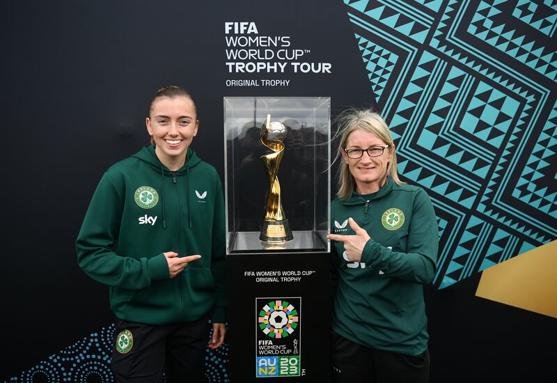 Republic of Ireland international Abbie Larkin and former Republic of Ireland international Olivia O'Toole with the Fifa Women’s World Cup trophy. at Irishtown Stadium in Dublin in May. Photograph: Stephen McCarthy/Sportsfile