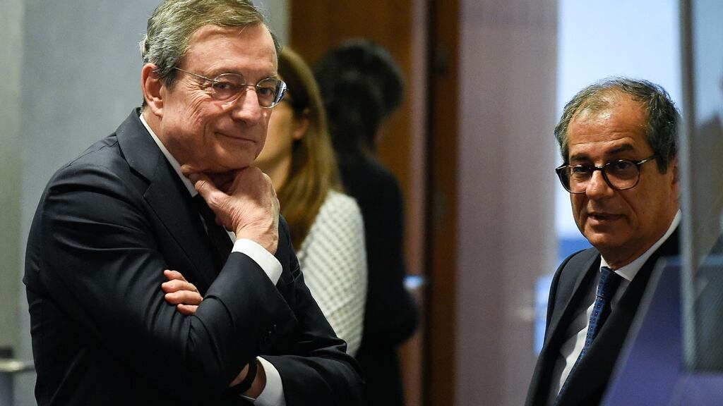 European Central Bank president Mario Draghi, left, with Italy’s economy and finance minister Giovanni Tria during the Eurogroup meeting at the EU headquarters in Luxembourg on Thursday. Photograph: John Thys/AFP/Getty Images