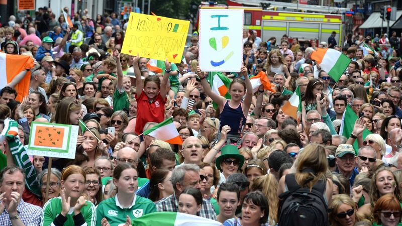 Fans enjoying the homecoming of the Irish hockey team on Dame Street follwing their reception at City Hall. Photograph: Cyril Byrne/THE IRISH TIMES