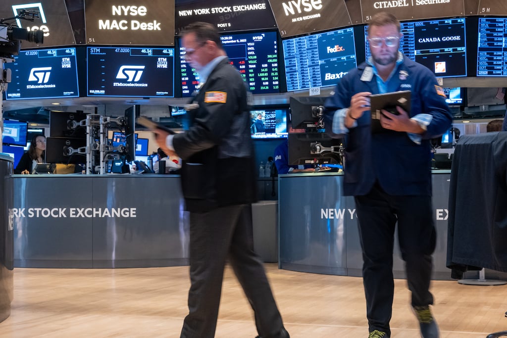 Traders work on the floor of the New York Stock Exchange. Photograph: Spencer Platt/Getty Images