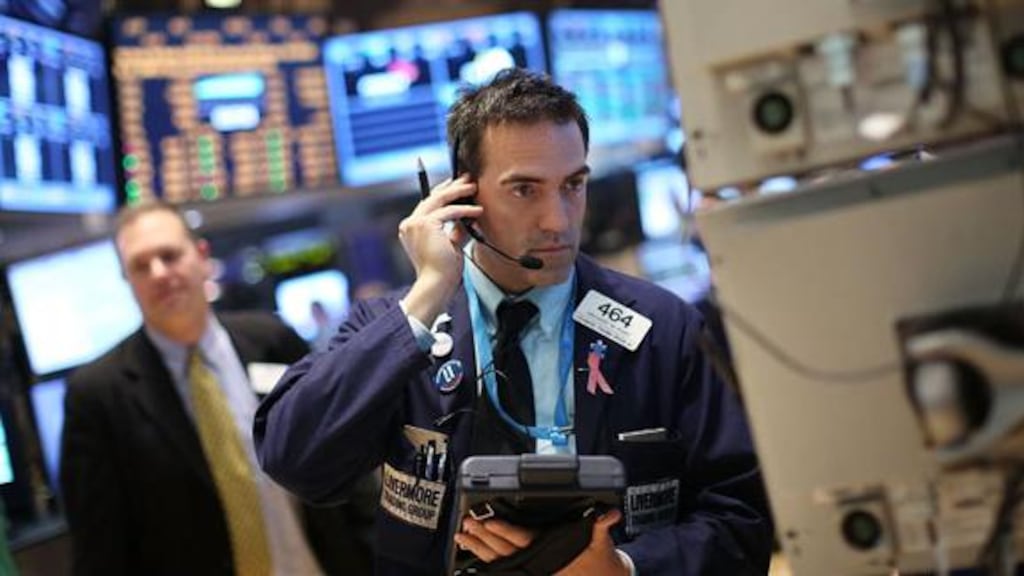 Traders work on the floor of the New York Stock Exchange. Photograph: Spencer Platt/Getty Images