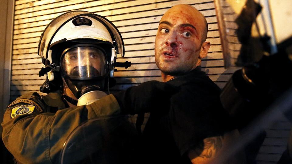 A protester is arrested by riot police following clashes in Athens on Wednesday. Photograph: Yannis Behrakis/Reuters