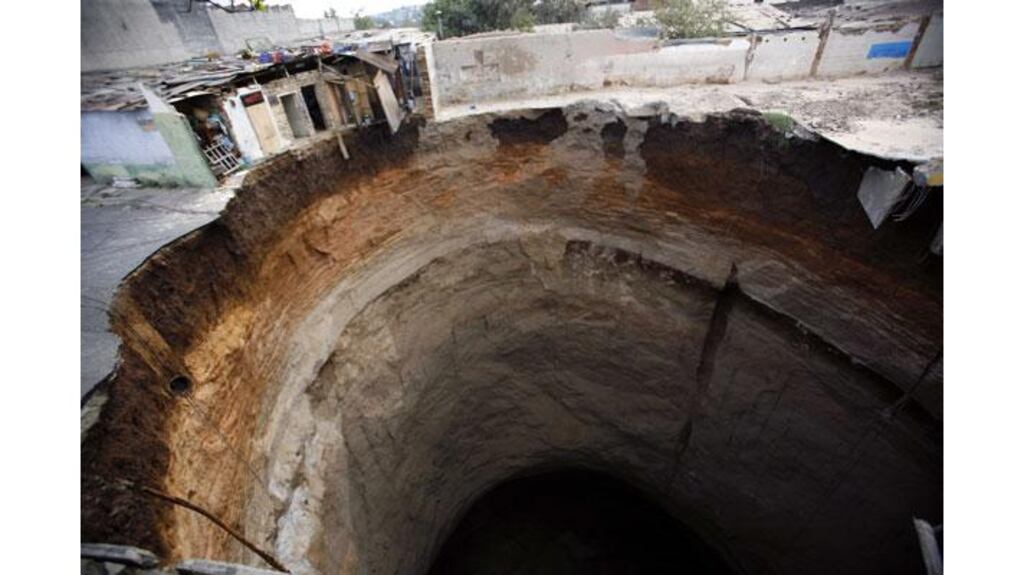 A giant sinkhole that swallowed several homes in Guatemala City in 2007. Photograph: Daniel LeClair/Reuters