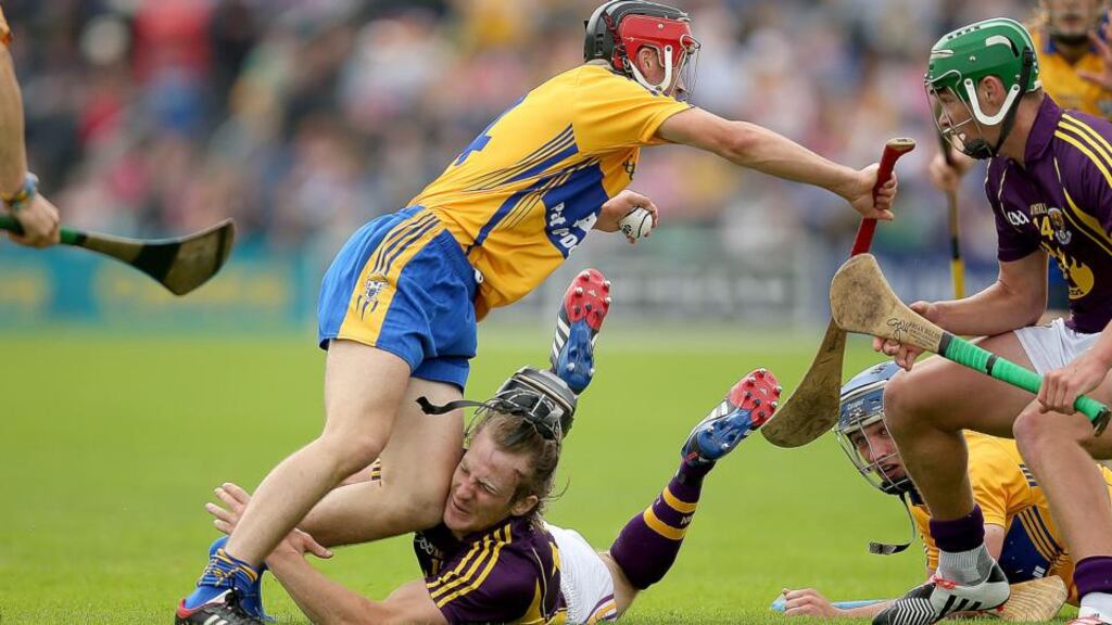 Wexford’s Liam Óg McGovern collides with the knee of Clare’s Jack Browne during the All-Ireland SHC Qualifier Round 1 Replay at Wexford Park. Photograph: Donall Farmer/Inpho