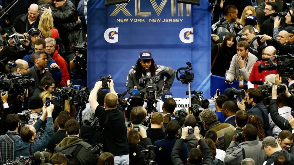 Seattle Seahawks cornerback Richard Sherman is mobbed by media during a press conference ahead of Super Bowl XLVIII      in Newark, New Jersey. Photograph: Jeff Zelevansky/Getty Images
