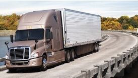 Daimler cuts profit forecast for trucks after poor sales