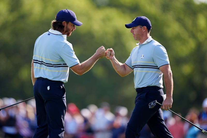 Europe's Rory McIlroy and Tommy Fleetwood during Friday's foursomes session. Photograph: Mike Egerton/PA