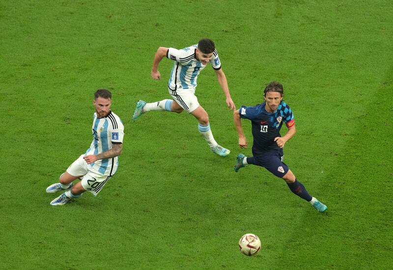 Argentina's Alexis Mac Allister and Julian Álvarez compete for possession with Croatia's Luka Modric during the World Cup semi-final. Photograph: Martin Rickett/PA Wire