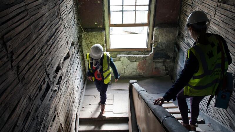 Carl Raftery, a conservation research officer with Dublin City Council, with reporter Olivia Kelly in the 17th century house on Aungier Street, Dublin, that is being restored. Photograph: Brenda Fitzsimons