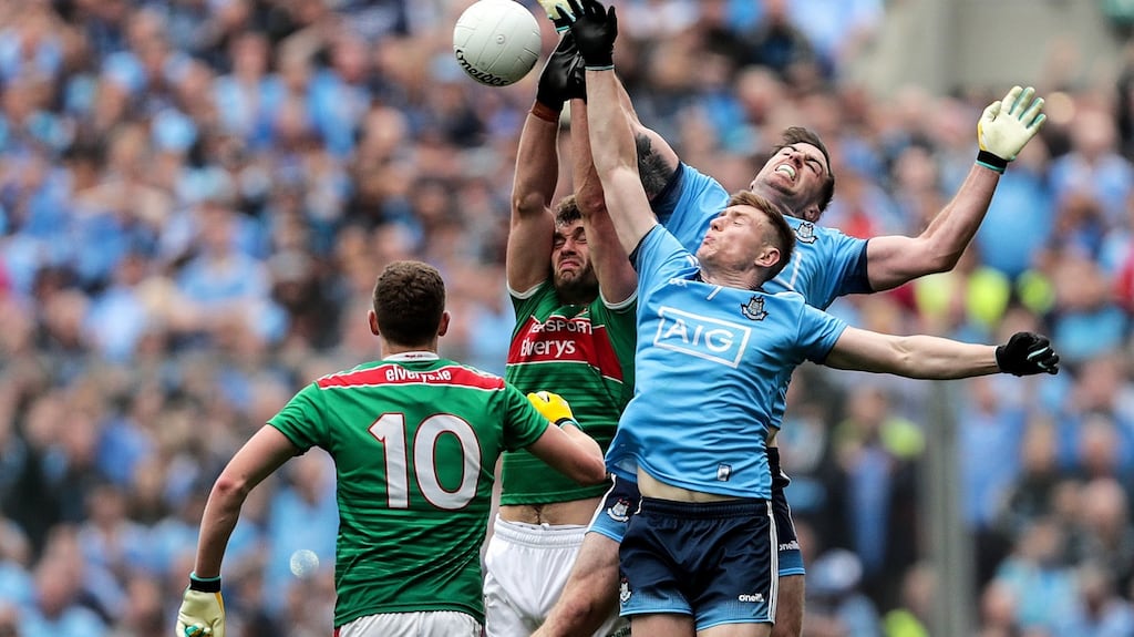 Mayo’s Aidan O’Shea with John Small and Michael Darragh Macauley of Dublin during last year’s semi-final. Photo: Laszlo Geczo/Inpho