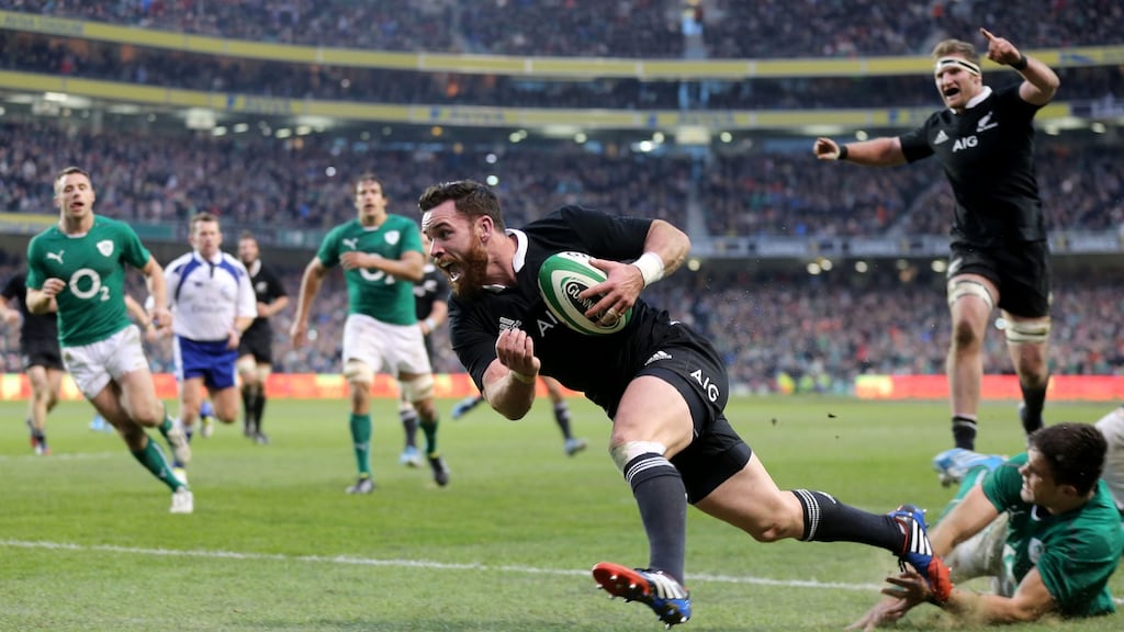 Ryan Crotty takes an offload from Dane Coles (not pictured) to score the winning try in the closing moments against Ireland at the Aviva Stadium in 2013. Photograph: James Crombie/Inpho.