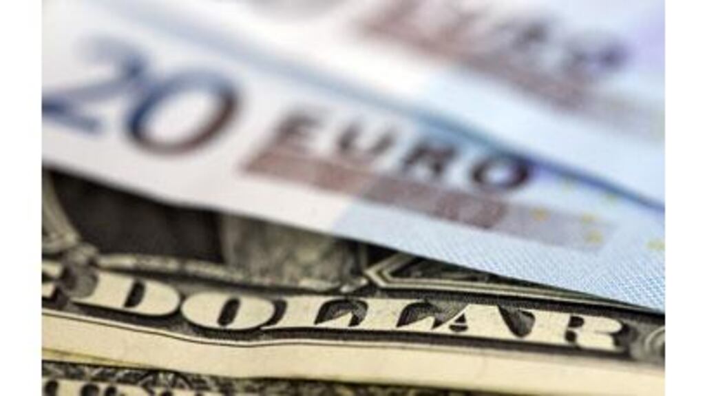 The euro hovered within sight of a two-week low against the dollar this morning as euro zone political uncertainty curbed demand.