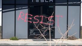 Musk tells Tesla staff ‘hang on to your stock’ after 50% plunge