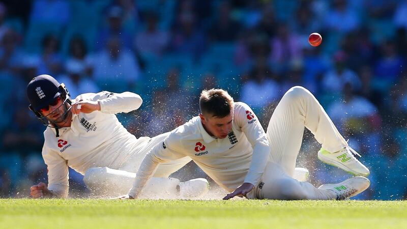 Debutant Mason Crane and Mark Stoneman see a chance go begging on day two at the SCG. Photograph: james O’Brien/PA
