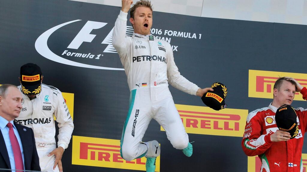 Mercedes F1 driver Nico Rosberg of Germany jumps on the podium as he celebrates victory at the Russian Grand Prix. Photo: Reuters