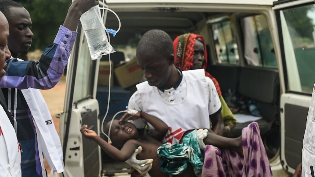 A child who has tested positive for malaria suffers convulsions after being treated in the MSF clinic. Photograph: Ikram N’gadi/MSF