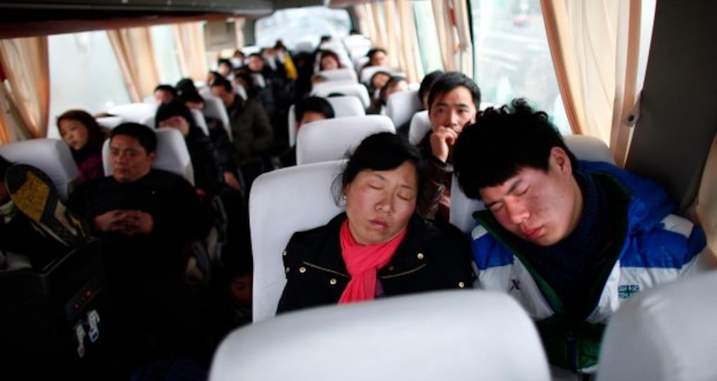 Rural residents like Wang Baiqiang (right) and his mother who commute to work in the city make up the majority of the workforce building China's new cities and motorways.