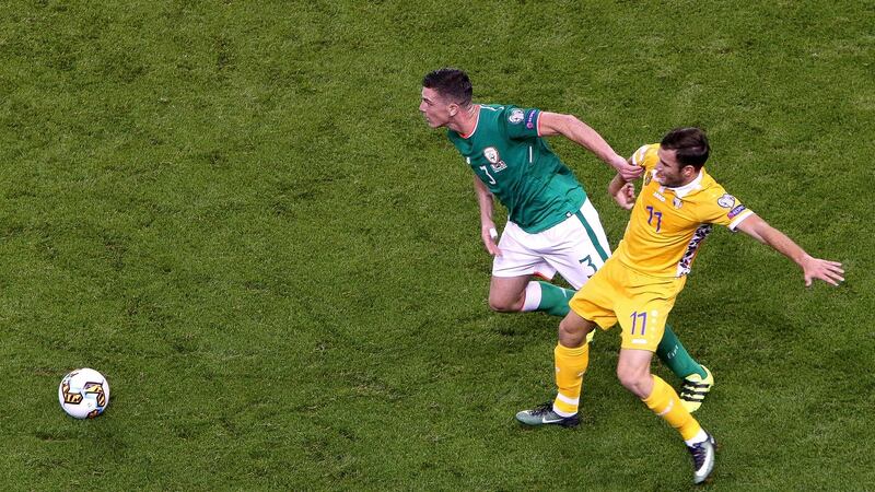 Ciaran Clark holds off Radu Ginsari. Photograph: Gary Carr/Inpho