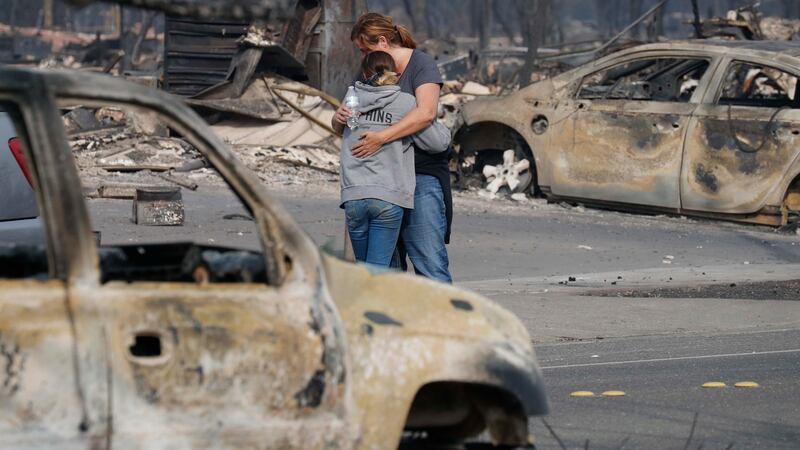 Residents embrace after viewing their destroyed home in Santa Rosa, California. Photograph: John G Mabanglo/EPA