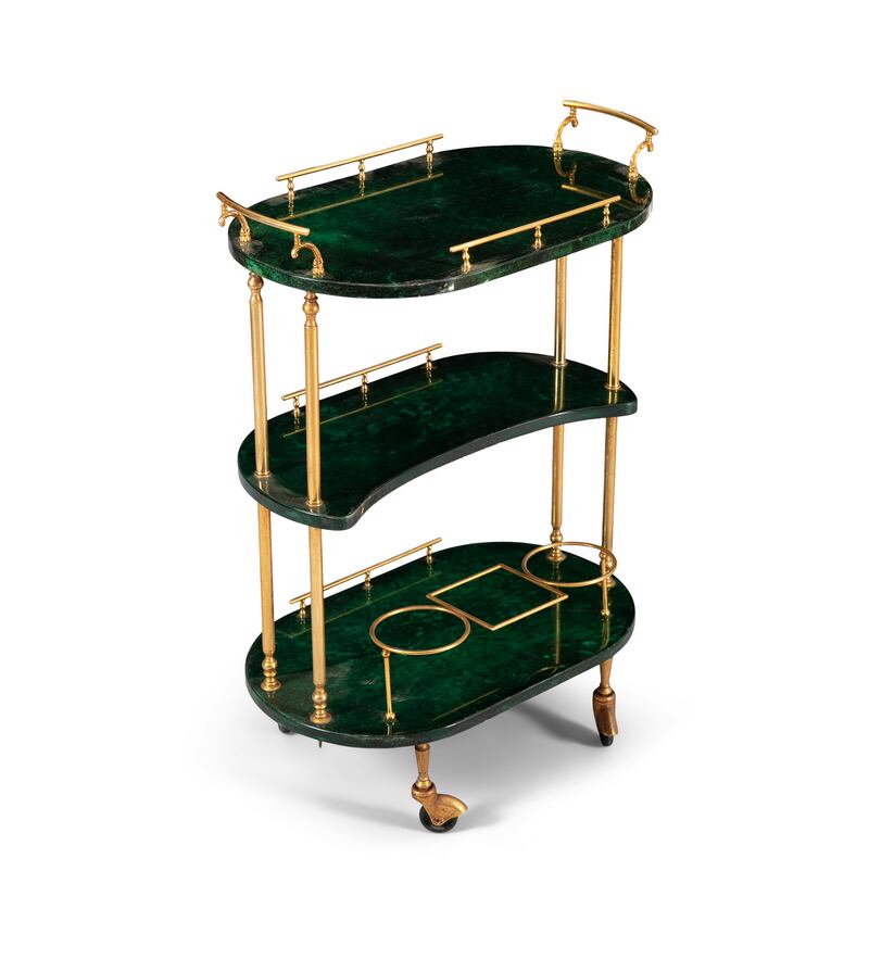 A three-tier drinks trolley with brass detailing lacquered goat skin by Aldo Tura, €800-€1,200