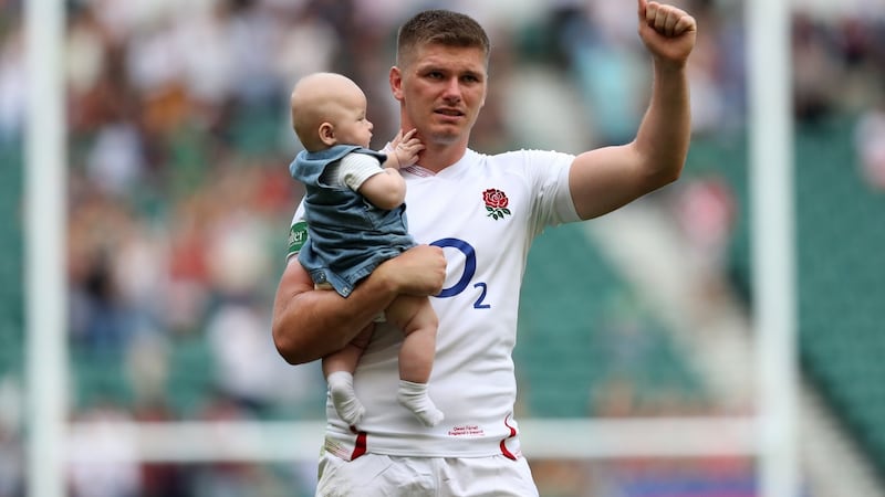 Owen Farrell with his son Tommy after England’s win over Ireland. Photograph: Shaun Botterill/Getty