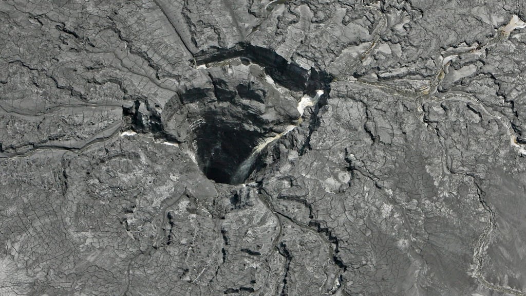 This aerial photo shows a massive 45 feet diameter sinkhole on Friday September 16th, 2016, in Florida that opened up underneath a gypsum stack at a Mosaic phosphate fertilizer plant. Tens of millions of gallons of reprocessed water from the fertilizer plant in central Florida are likely to have seeped into the Floridan aquifer. Photograph: AP