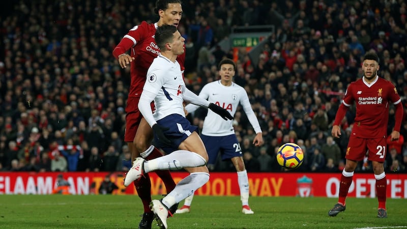 Virgil van Dijk fouls Erik Lamela to give Spurs a last minute penalty at Anfield. Photograph: Andrew Yates/Reuters