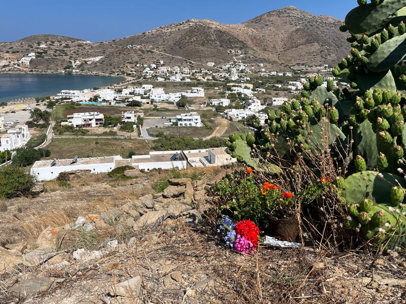 Flowers laid at the site of the rocky hill where it is believed Andrew O’Donnell fell and died on Ios. Photograph: Jack Power