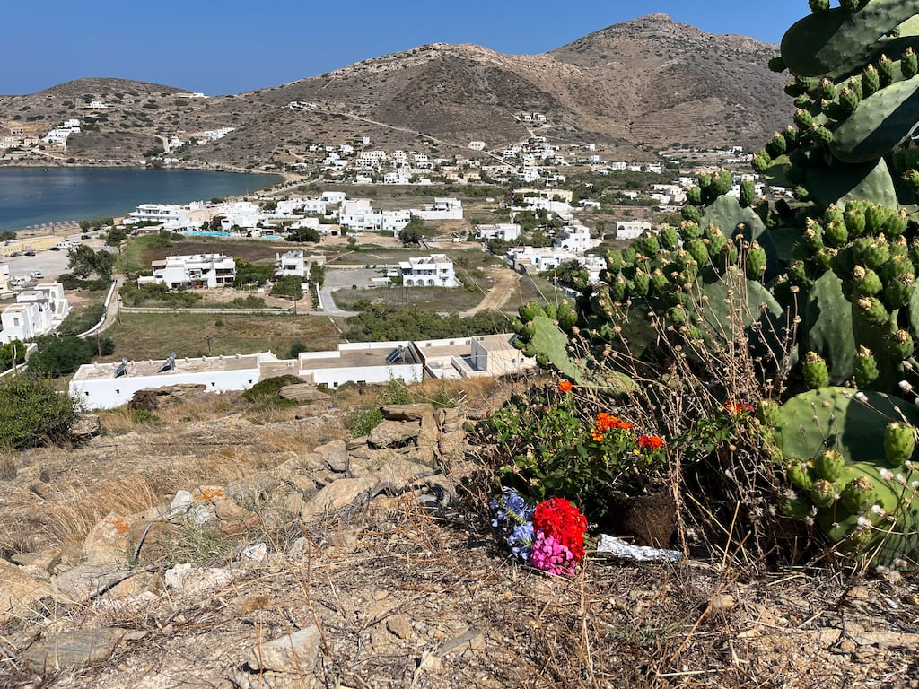 Irish deaths in Greece: Flowers lie at the site on the rocky hill where it is believed Andrew O’Donnell fell and died on the Greek island of Ios. Photograph: Jack Power