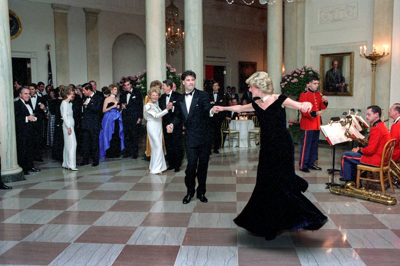 Princess Diana dances with John Travolta in Cross Hall at the White House during an official dinner on November 9th, 1985. Photograph: Pete Souza/The White House via Getty