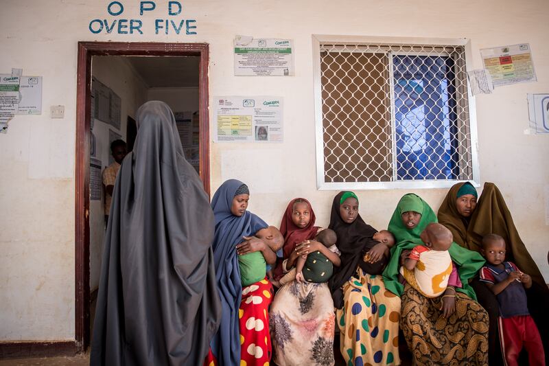 Women wait to have their children screened for malnutrition at a health clinic in Somalia. Photograph: Sally Hayden